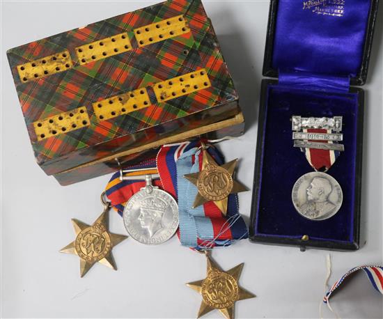 A group of four WWII medals and a silver medal etc